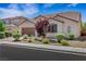 Attractive home with desert landscaping, a tile roof, and a two-car garage at 5713 Silver Cascade Ave, Las Vegas, NV 89131