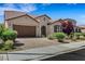 Charming home featuring a tile roof, desert landscaping, and brick driveway at 5713 Silver Cascade Ave, Las Vegas, NV 89131