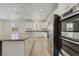 Beautiful kitchen featuring a large island, stainless appliances, and ample counter space at 5713 Silver Cascade Ave, Las Vegas, NV 89131
