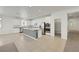 Modern kitchen features white cabinets, stainless steel appliances, and spacious island at 5713 Silver Cascade Ave, Las Vegas, NV 89131