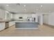 Spacious kitchen features white cabinets, a large island, and stainless steel appliances at 5713 Silver Cascade Ave, Las Vegas, NV 89131