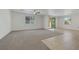 Large living area boasts carpet, tile, a ceiling fan, and lots of natural light at 5713 Silver Cascade Ave, Las Vegas, NV 89131