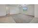 Large living area with a ceiling fan, natural light, and mixed tile and carpet flooring at 5713 Silver Cascade Ave, Las Vegas, NV 89131