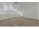 Loft area features neutral carpet, high ceilings, white walls, a railing and a window at 5713 Silver Cascade Ave, Las Vegas, NV 89131