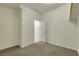 Carpeted walk-in closet features neutral paint, rod and access to the bathroom at 5713 Silver Cascade Ave, Las Vegas, NV 89131