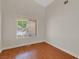 Empty bedroom featuring wood floors and a window at 5900 Red Umber Ave, Las Vegas, NV 89130