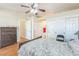 Bedroom featuring wood floors, ensuite bathroom and closet space at 5900 Red Umber Ave, Las Vegas, NV 89130
