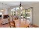 Open dining area with tile flooring adjacent to the living room at 5900 Red Umber Ave, Las Vegas, NV 89130