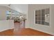Entryway leading to the living room with hardwood flooring at 5900 Red Umber Ave, Las Vegas, NV 89130