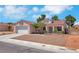 Charming single-story home with a two-car garage and desert landscaping at 5900 Red Umber Ave, Las Vegas, NV 89130