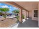 Covered front porch showing desert landscaping, and neighborhood street at 5900 Red Umber Ave, Las Vegas, NV 89130