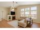 Bright living room with fireplace, ceiling fan, and neutral-colored decor at 5900 Red Umber Ave, Las Vegas, NV 89130