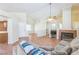 Cozy living room featuring a fireplace and tile flooring at 5900 Red Umber Ave, Las Vegas, NV 89130