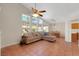 Spacious living room featuring tile flooring and large windows showcasing outdoor views at 5900 Red Umber Ave, Las Vegas, NV 89130