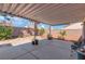 Covered patio offers respite with its desert landscaping and views of mature trees at 5900 Red Umber Ave, Las Vegas, NV 89130