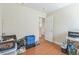 Empty room with wood floors and a doorway to another room at 5900 Red Umber Ave, Las Vegas, NV 89130