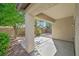 Inviting back patio area surrounded by mature landscaping, offering a private outdoor retreat at 6001 Falconer Ave, Las Vegas, NV 89122