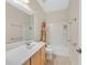 Bright bathroom with shower-tub combination, single sink vanity, and soft lighting at 6001 Falconer Ave, Las Vegas, NV 89122