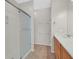Bathroom features a shower, tiled floor, mirror, and a single sink vanity at 6001 Falconer Ave, Las Vegas, NV 89122
