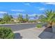 Street view of a beautiful community with mature trees and landscaping at 6001 Falconer Ave, Las Vegas, NV 89122