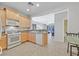 Bright kitchen featuring light wood cabinets and modern appliances at 6001 Falconer Ave, Las Vegas, NV 89122