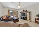 Inviting living room with tile flooring, comfortable seating, and sliding doors to the outdoors at 6001 Falconer Ave, Las Vegas, NV 89122