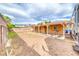 This home's backyard includes a covered patio and substantial space for customization at 632 Arrayo Way, Boulder City, NV 89005