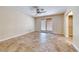 Spacious bedroom with tile floors, ceiling fan, and double doors leading to the backyard at 632 Arrayo Way, Boulder City, NV 89005