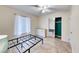 Well lit bedroom with tile flooring, ceiling fan, and a closet with mirrored doors at 632 Arrayo Way, Boulder City, NV 89005