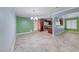 Open-concept dining area features neutral tile flooring, colorful walls, and an elegant chandelier at 632 Arrayo Way, Boulder City, NV 89005