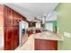 Kitchen features stainless steel appliances, granite countertops, and cherry wood cabinets at 632 Arrayo Way, Boulder City, NV 89005