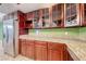 Updated kitchen with granite counters, cherry cabinets and stainless steel appliances at 632 Arrayo Way, Boulder City, NV 89005