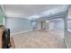 Open living room area with tile flooring, neutral paint, and plenty of natural light at 632 Arrayo Way, Boulder City, NV 89005