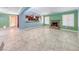 Open living room with tile floors, a fireplace, and access to the kitchen area at 632 Arrayo Way, Boulder City, NV 89005