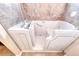 Close-up of a safe step walk-in tub with jets and hand-held shower head at 632 Arrayo Way, Boulder City, NV 89005