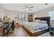 Bedroom with natural lighting, and tile floors with neutral paint at 6928 Smiling Cloud Ave, Henderson, NV 89011