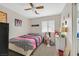 A cozy bedroom with carpet, ceiling fan, plus a window that provides natural light at 6928 Smiling Cloud Ave, Henderson, NV 89011