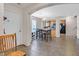 Dining room with tile floors and natural lighting leading into kitchen at 6928 Smiling Cloud Ave, Henderson, NV 89011