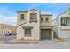 Charming two-story home with stucco exterior, garage, and well-maintained landscaping at 6928 Smiling Cloud Ave, Henderson, NV 89011