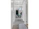 Hallway with carpet and white doors leading to different rooms at 6928 Smiling Cloud Ave, Henderson, NV 89011