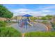Community playground with blue playground equipment including slides and ladders at 6928 Smiling Cloud Ave, Henderson, NV 89011