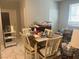 Cozy dining area with a wooden table and chairs near ample storage spaces at 7527 Ardenno St, North Las Vegas, NV 89084