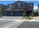 Charming two-story home with a two-car garage and a beautifully landscaped front yard at 7527 Ardenno St, North Las Vegas, NV 89084
