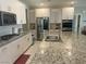 Well-equipped kitchen boasts stainless steel appliances, granite countertops, and ample cabinet space at 7527 Ardenno St, North Las Vegas, NV 89084