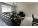 Comfortable living room with marble floors and large windows at 7527 Ardenno St, North Las Vegas, NV 89084