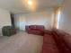 Second floor living room with cozy furniture and large windows at 7527 Ardenno St, North Las Vegas, NV 89084