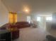 Second floor living room with cozy furniture and large windows at 7527 Ardenno St, North Las Vegas, NV 89084