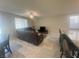 Inviting living area adjacent to kitchen with plush seating, tile floors, and lots of natural light at 7527 Ardenno St, North Las Vegas, NV 89084