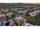 Scenic aerial shot of a suburban neighborhood with diverse houses, tree-lined streets, and community charm at 7616 Gossamer Wind St, Las Vegas, NV 89139