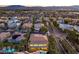 Picturesque aerial view of a residential area featuring well-maintained homes, mature trees, and neighborhood streets at 7616 Gossamer Wind St, Las Vegas, NV 89139